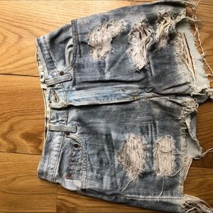 High waisted vintage levi mega distressed shorts